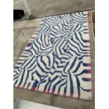 A CHRISTIAN LACROIX DESIGNERS GUILD RIVIERA SERIES RUG (160CM x 260CM)