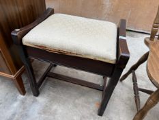 AN EDWARDIAN PIANO STOOL WITH LIFT UP UPHOLSTERED SEAT