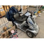 A STRIDER ST6 MOBILITY SCOOTER WITH KEY AND CHARGER