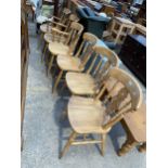 A SET OF SIX VICTORIAN STYLE KITCHEN CHAIRS WITH PIERCED SPLAT BACKS, TWO BEING CARVERS