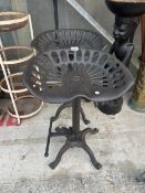 A PAIR OF TRACTOR SEAT STYLE STOOLS