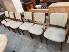 A SET OF SIX RETRO TEAK DINING CHAIRS, TWO BEING CARVERS WITH UPHOLSTERED SEATS AND BACKS