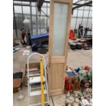 A FOLDING WOODEN DOOR, A STEP LADDER AND A SPIRIT LEVEL