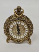 A VINTAGE EMES STYLE BRASS MECHANICAL ALARM TABLE CLOCK IN AN ORNATE GOLD-TONED BRASS CASING AND A