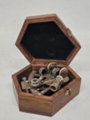 A VINTAGE BRASS NAUTICAL SEXTANT IN A WOODEN BOX