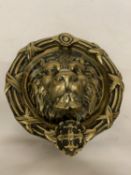 A MAJESTIC CASTLE SOLID BRASS LION HEAD DOOR KNOCKER