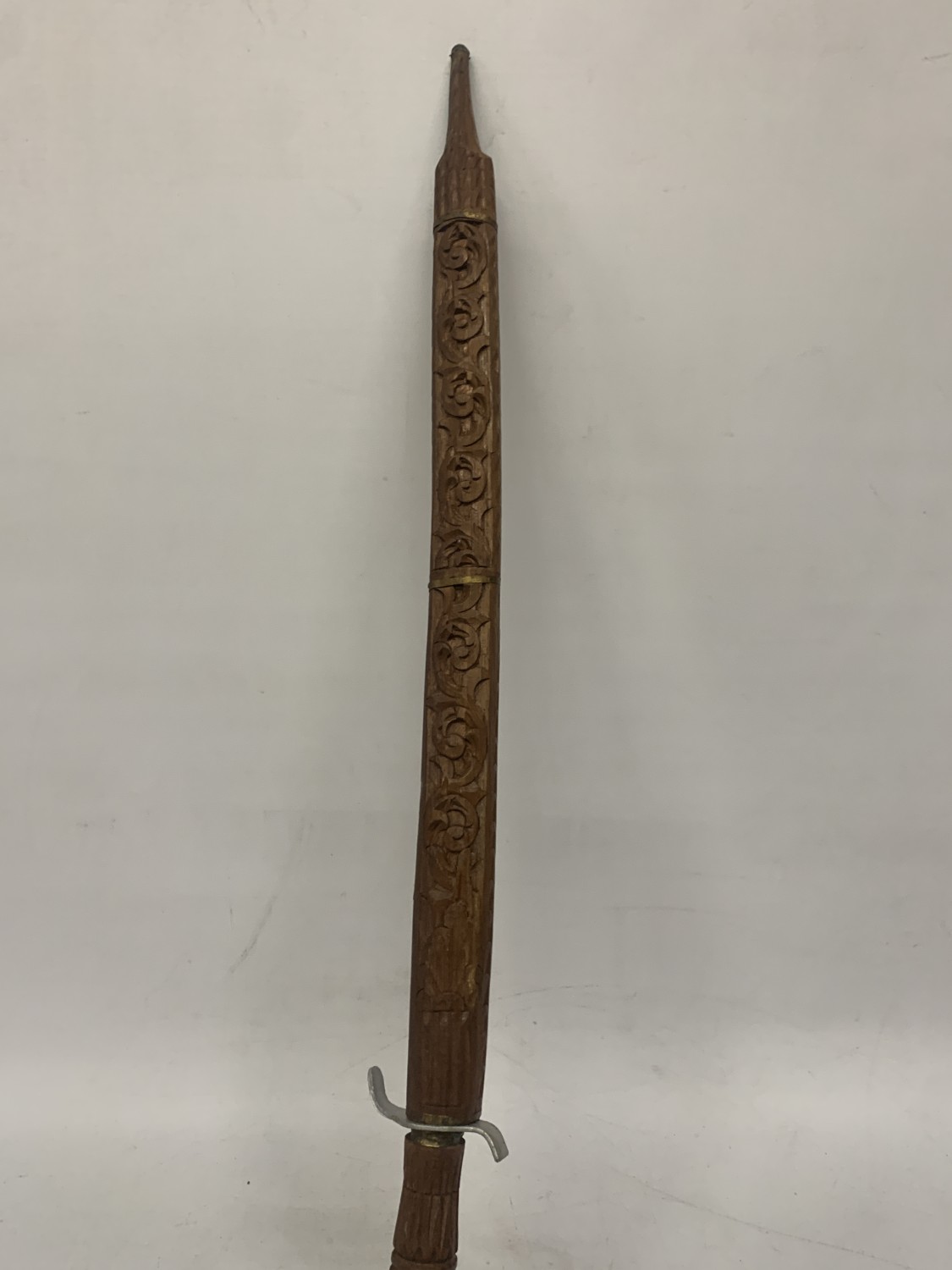 AN ORIENTAL SWORD WITH CARVED HILT AND SHEATH
