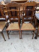 A PAIR OF EDWARDIAN MAHOGANY BEDROOM CHAIRS WITH CANE SEATS