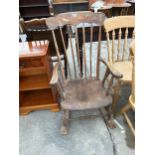A VICTORIAN STYLE ELM AND BEECH ROCKING CHAIR