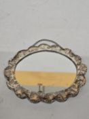 A SILVER OVAL CONTINENTAL OTTOMAN PERIOD REPOUSSE-BACKED MIRROR MARKED 900 - 16 CM (D)