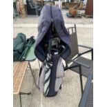 A GOLF BAG WITH AN ASSORTMENT OF VARIOUS CLUBS