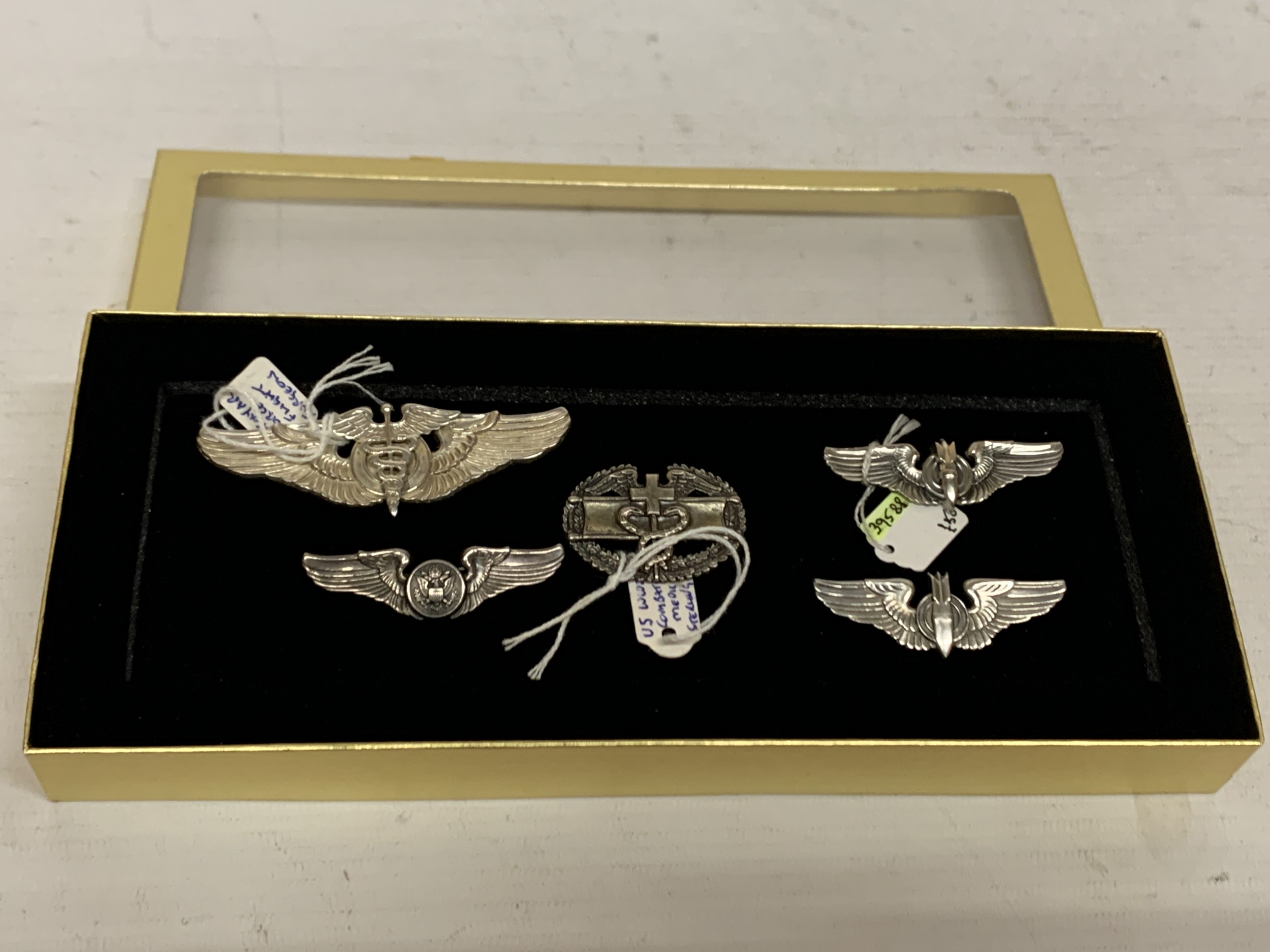 A SELECTION OF FIVE USA STERLING SILVER AIRFORCE BADGES