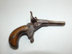 AN ANTIQUE BLANK FIRING POSTMANS/CYCLISTS RIMFIRE PISTOL, USED TO SCARE OFF AGGRESSIVE DOGS,