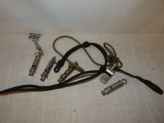 A COLLECTION OF FIVE WHISTLES TO INCLUDE TWO DATED 1939, ARP WHISTLE, BOY SCOUTS ETC.