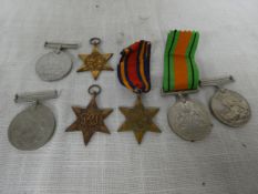 A COLLECTION OF SEVEN WORLD WAR II MEDALS COMPRISING TWO 1939-45 STARS, BURMA STAR, THREE 1939-45
