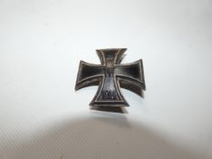 AN IMPERIAL GERMAN WORLD WAR I IRON CROSS, FIRST CLASS, THE BREAST BADGE BEARS DATE 1914
