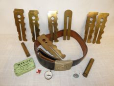 A GERMAN BELT AND BUCKLE, TWO OIL BOTTLES, BRASS BUTTON CLEANING SLIDES, COMPASS, MAXIM TAKE DOWN