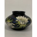 A MOORCROFT QUEEN OF THE NIGHT SQUAT VASE, DESIGNED BY ANJI DAVENPORT AND SIGNED TO THE BASE, HEIGHT