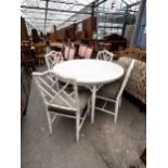 A WHITE PAINTED DINING TABLE, 43" DIAMETER, ON FAUX BAMBOO LEGS AND FOUR FAUX BAMBOO CHAIRS