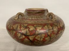A LARGE ORIENTAL STYLE HAND-PAINTED POT FEATURING FOUR HANDLES AND DISTINCT RED AND GOLD GEOMETRIC
