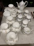 A SHERIDAN TEASET TO INCLUDE A SUGAR BOWL, CREAM JUG, CUPS, SAUCERS, AND SIDE PLATES PLUS A