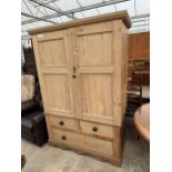 A VICTORIAN PINE TWO DOOR WARDROBE WITH TWO SHORT AND ONE DRAWER TO BASE, 52" WIDE