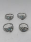 FOUR SILVER AND OPAL RINGS GROSS WEIGHT 16.62 GRAMS