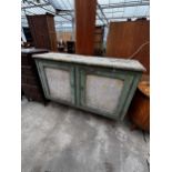 A VICTORIAN PINE TWO DOOR PAINTED CUPBOARD ON LATER HAIRPIN LEGS, 50" WIDE