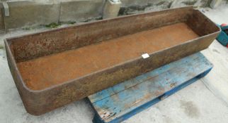 A LARGE CAST IRON TROUGH NO VAT