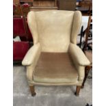 A PARKER KNOLL (MODEL NO. P.K.711) WINGED FAUX LEATHER FIRESIDE CHAIR