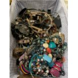 A BASKET CONTAINING A QUANTITY OF COSTUME JEWELLERY TO INCLUDE NECKLACES, BEADS, BANGLES, ETC