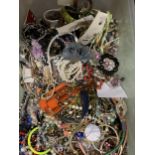 A VERY LARGE COLLECTION OF COSTUME JEWELLERY TO INCLUDE NECKLACES, BEADS, BRACELETS, BANGLES ETC