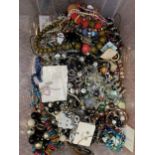 A LARGE BOX OF COSTUME JEWELLERY TO INCLUDE NECKLACES, BRACELETS, RINGS, BANGLES, BEADS ETC