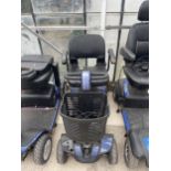 A GOGO MOBILITY SCOOTER WITH KEY AND CHARGER