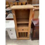 A MEXICAN PINE OPEN STORAGE UNIT WITH SINGLE DRAWER AND SIXTEEN BOTTLE WINE RACK, 22" WIDE
