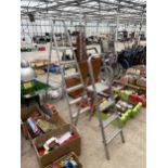 AN ALUMINIUM FIVE RUNG STEP LADDER AND A FURTHER THREE RUNG ALUMINIUM STEP LADDER