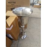 A CHAMPAGNE BUCKET ON STAND