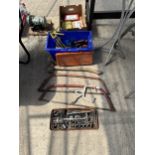 AN ASSORTMENT OF TOOLS TO INCLUDE BOW SAWS, SLEDGE HAMMER AND SOCKETS ETC