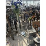 A STANDARD LAMP AND A LARGE GLASS VASE