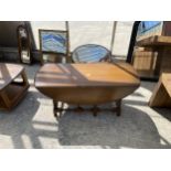 AN ERCOL ELM COFFEE TABLE, 42" X 36" OPENED