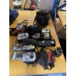 A LARGE COLLECTION OF DIGITAL CAMERAS TO INCLUDE KODAK, AND INCLUDING LENSES, BAGS ETC