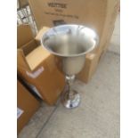 A CHAMPAGNE BUCKET ON STAND