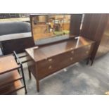 A G PLAN E GOMME DRESSING TABLE ENCLOSING SIX DRAWERS ON BRASS FEET, 60" WIDE