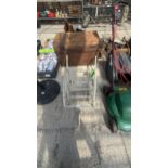 A METAL GARDEN WHEEL BARROW PLANT STAND