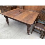 A VICTORIAN OAK WIND OUT DINING TABLE ON TURNED AND FLUTED LEGS WITH CANTED CORNERS, 61" X 51" (