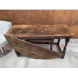 A GEORGE III OAK GATE LEG DINING TABLE ON TURNED LEGS, 61" X 58" OPENED