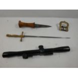 A VINTAGE DAGGER 11CM BLADE, BELT BUCKLE TELESCOPIC SIGHT AND A DAGGER WITH BRASS GRIP