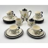 A mid-century tea set with eggshell texture and thistle design, comprising twenty-one pieces