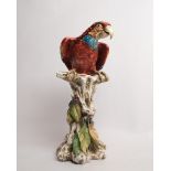 Porzellanfigur, "Ara", Italien, 20. Jh., polychrom, Papagei auf Baumstamm, bezeichnet, Modellentwur
