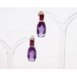 Paar Ohrstecker, als Hänger, 18kt Weißgold, Amethyste zus. ca. 16.8 ct., Rhodolithe zus. ca. 2.64 c